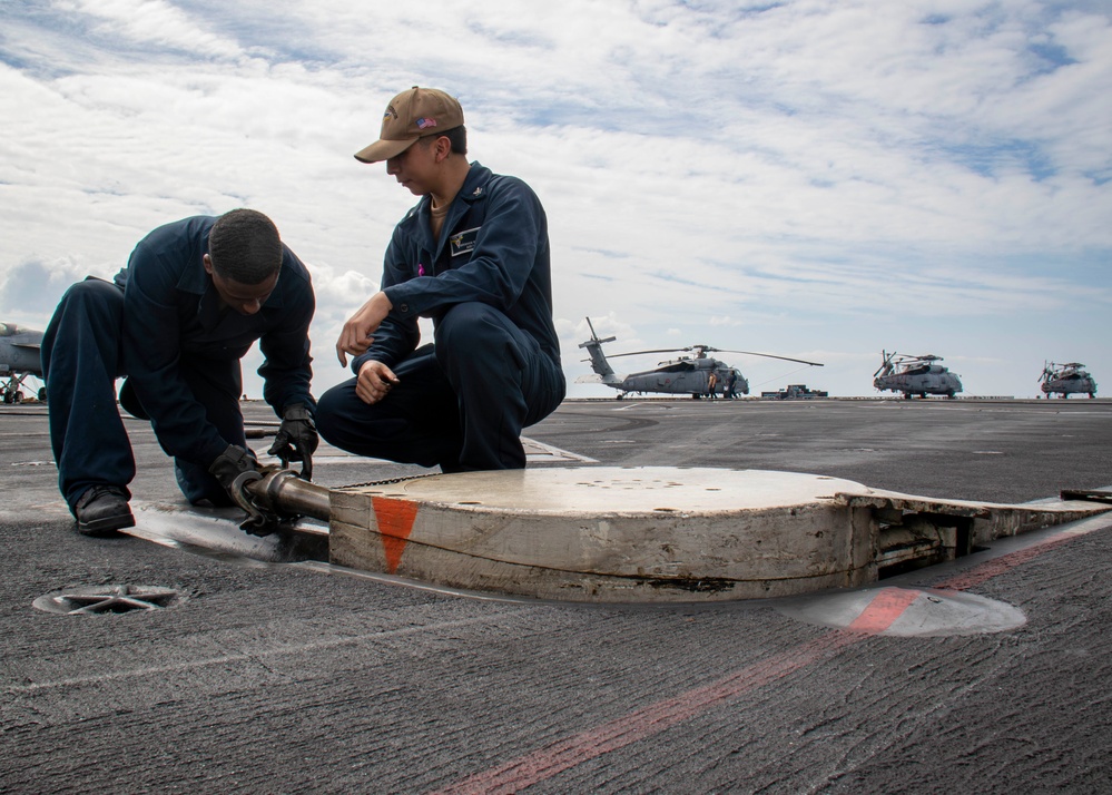 USS Carl Vinson (CVN 70) Sailors Conduct Arresting Gear Maintenance