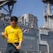 USS Bataan Sailors Scrub the Flight Deck