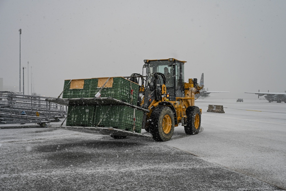 Team Little Rock operates under snowfall