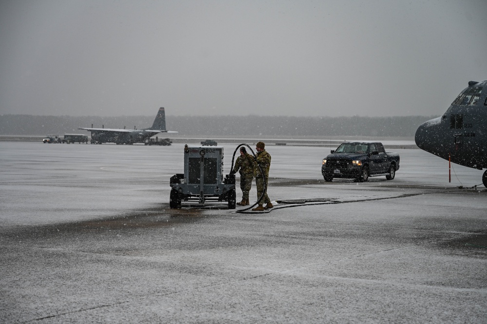 Team Little Rock operates under snowfall