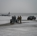 Team Little Rock operates under snowfall