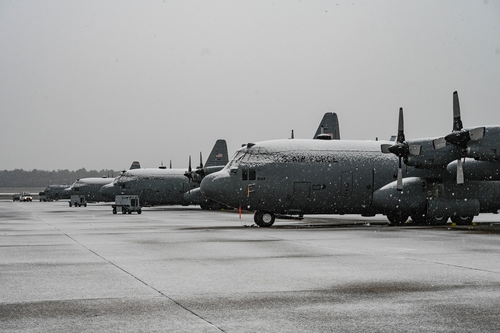 Team Little Rock operates under snowfall