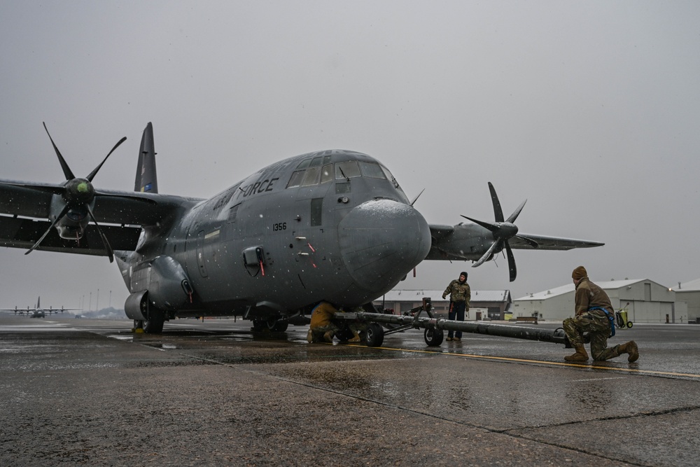 Team Little Rock operates under snowfall