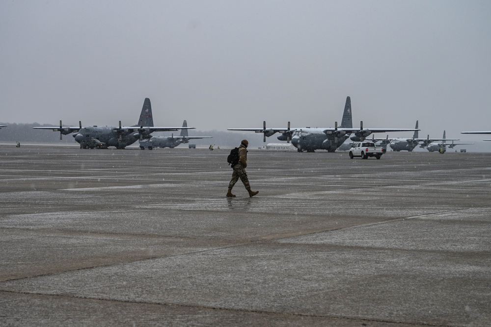 Team Little Rock operates under snowfall