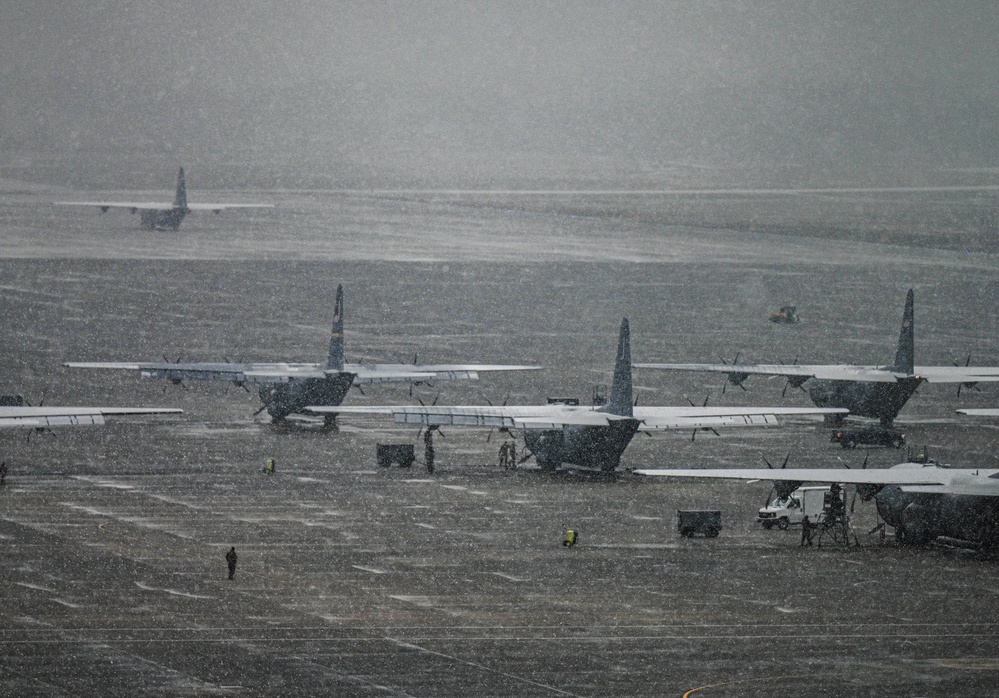 Team Little Rock operates under snowfall