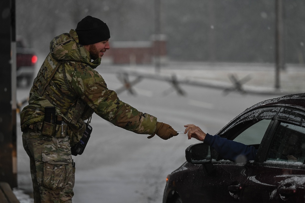 Team Little Rock operates under snowfall