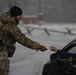 Team Little Rock operates under snowfall