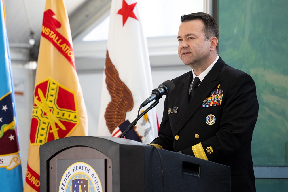 Rear Adm. Brandon Taylor addresses guests of the DCPH-A Ribbon Cutting