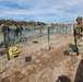Texas Guardsmen turn back a group of illegals at river barrier