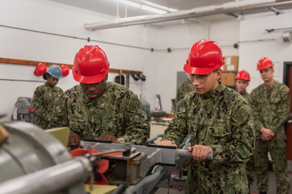 New Accession Sailors Conduct Weapons Training