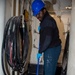 USS Ronald Reagan (CVN 76) Sailors apply clear epoxy