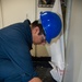 USS Ronald Reagan (CVN 76) Sailors apply clear epoxy