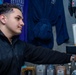 USS Ronald Reagan (CVN 76) Sailor works in hangar bay kiosk