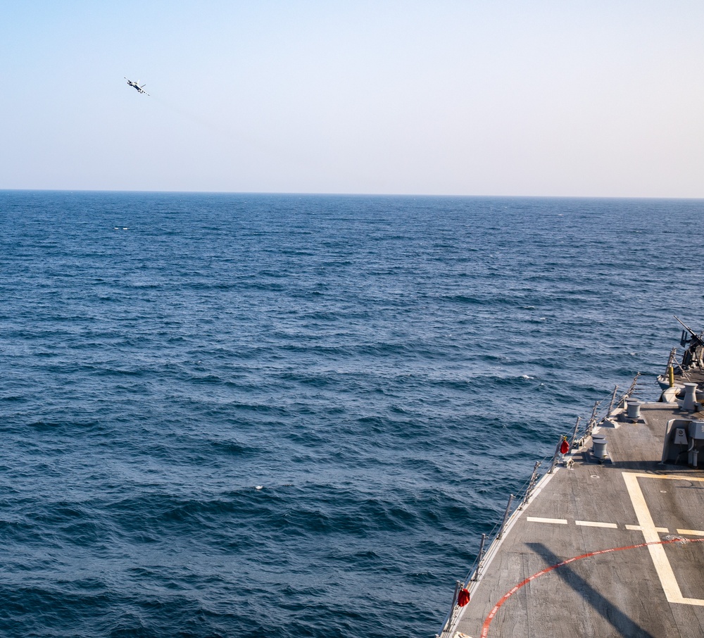 USS Gravely Conducts Fly-by with VAQ-130