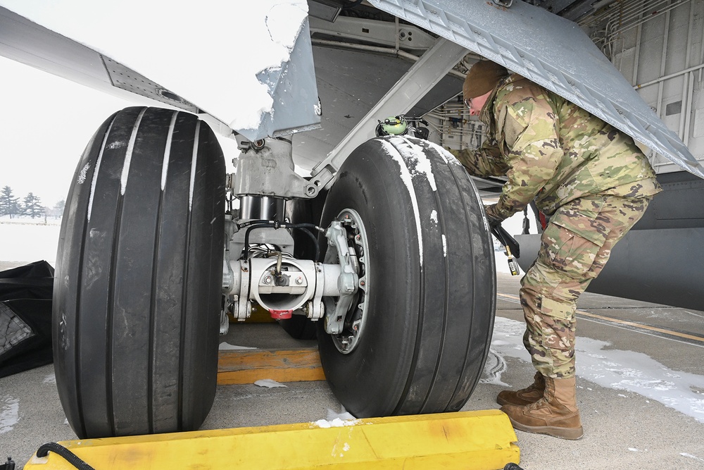 Airman Inspects Landing Gear During Winter Storm at Selfridge Air National Guard Base