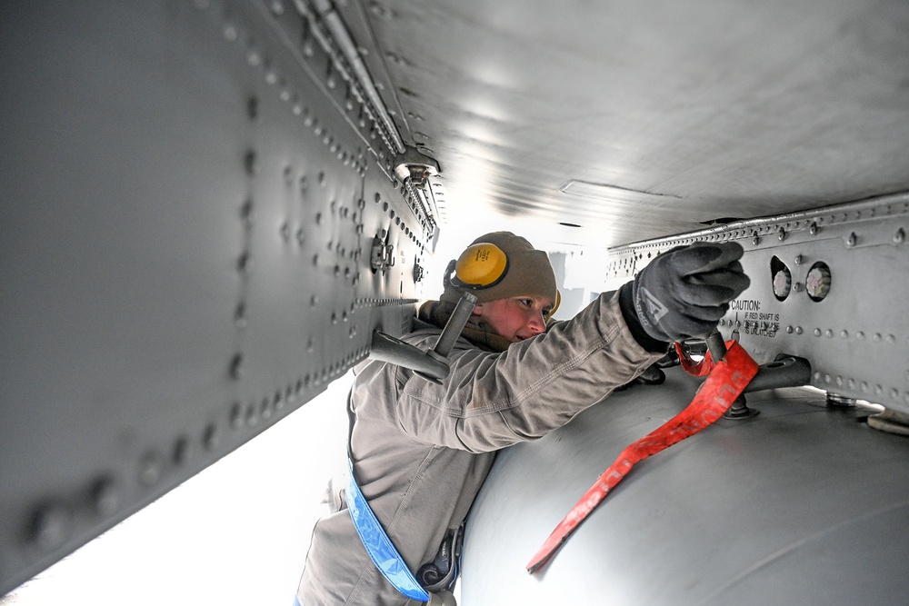 Airman Conducts Preparation for Weapons Loading on A-10C Thunderbolt II During Winter Storm