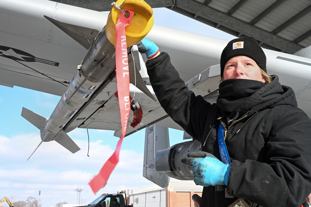 Airman Conducts Weapons Inspection on AIM-9 Sidewinder Missile During Winter Storm