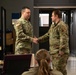 U.S. Army officer coins a 107th Attack Wing member for his efforts during the Buffalo winter storm