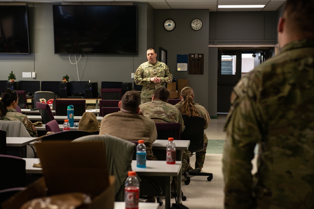U.S. Army officer speaks to members of the 107th Attack Wing after the Buffalo winter storm