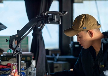 USS Kidd (DDG 100) Sailor Writes In Deck Log