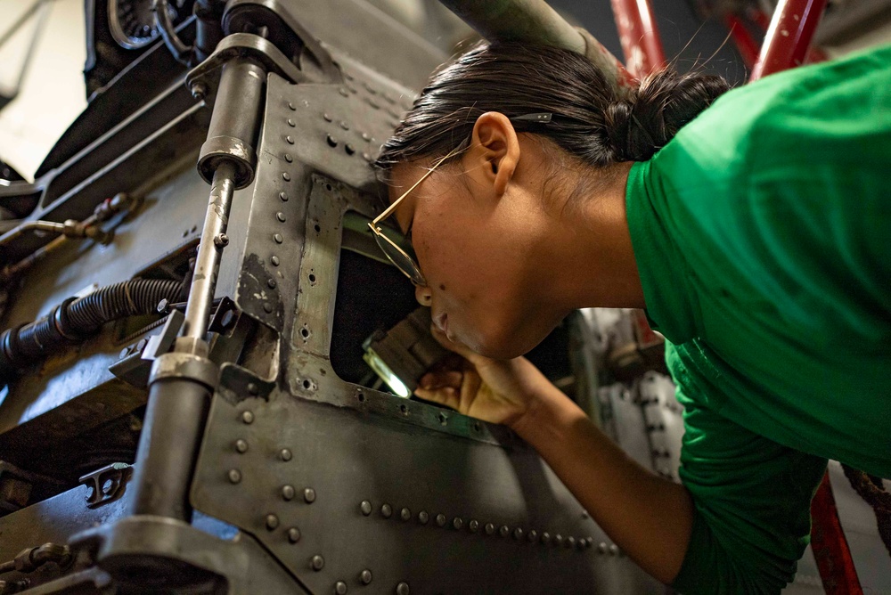 Sailors Conduct Maintenance on an MH-60R