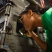 Sailors Conduct Maintenance on an MH-60R