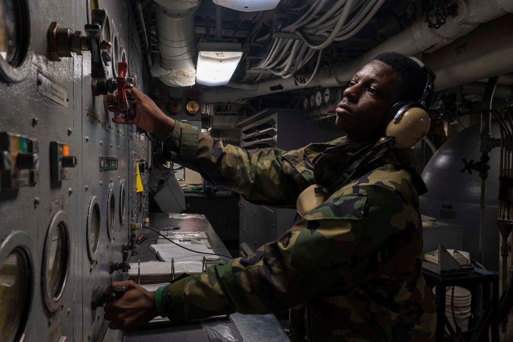 USS Carl Vinson (CVN 70) Sailor Operates Valves