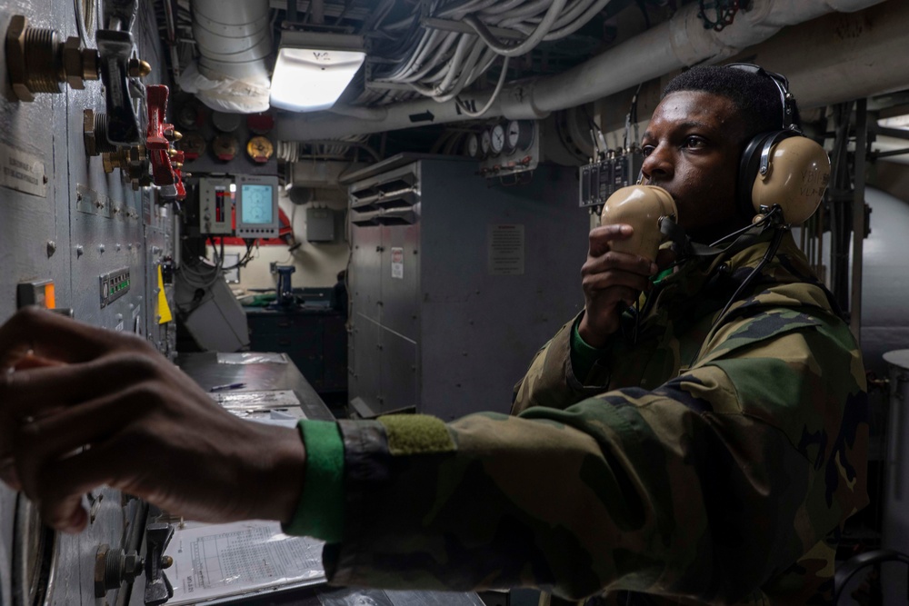 USS Carl Vinson (CVN 70) Sailor Operates Valves In A Catapult Room