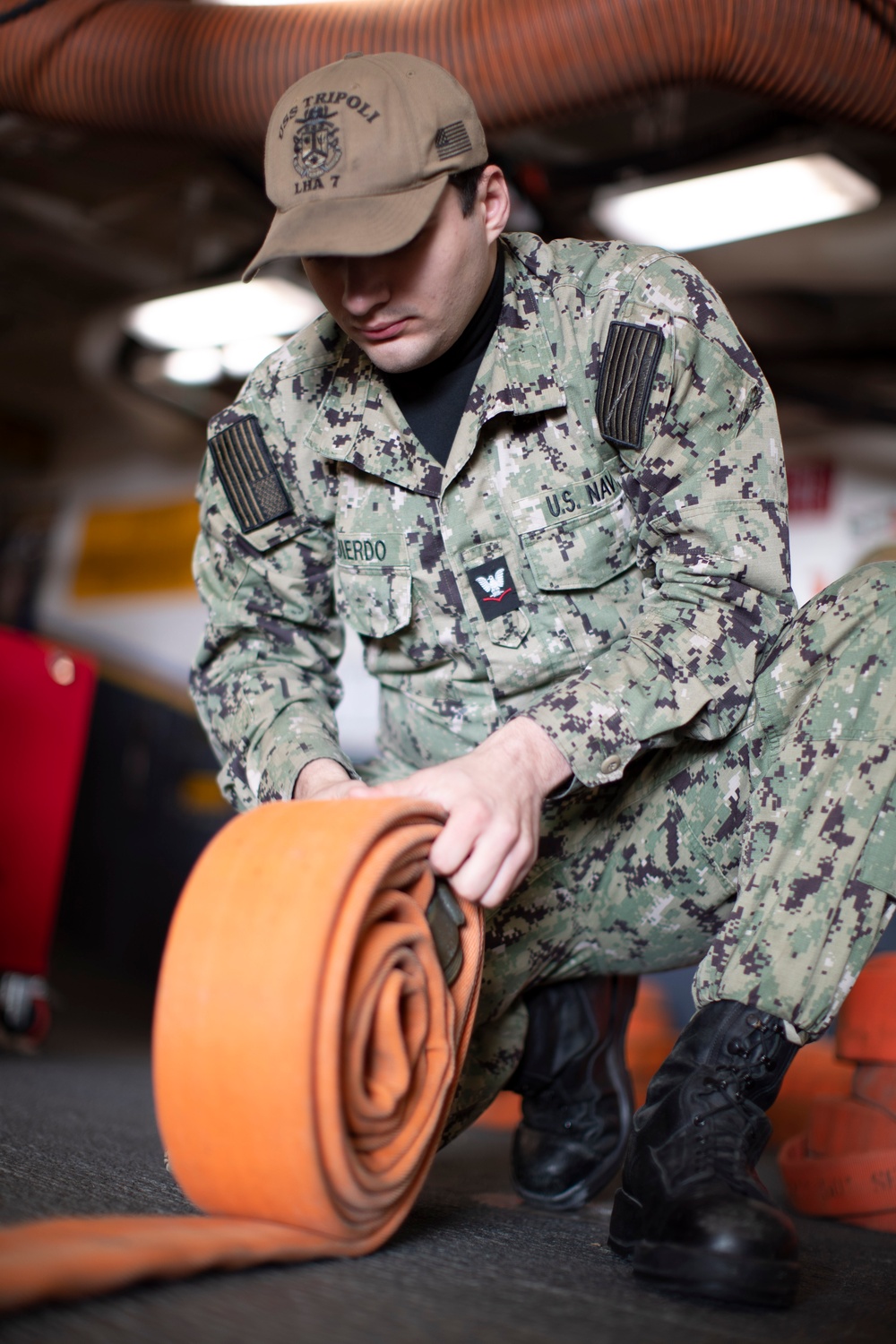 USS Tripoli Sailors Perform Maintenance