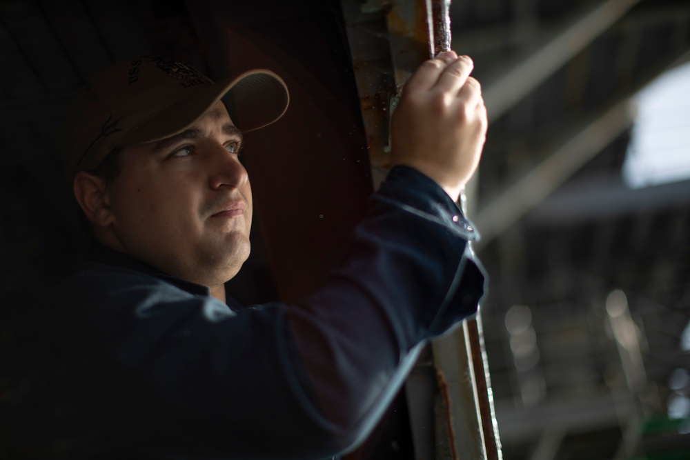 USS Tripoli Sailors Perform Maintenance