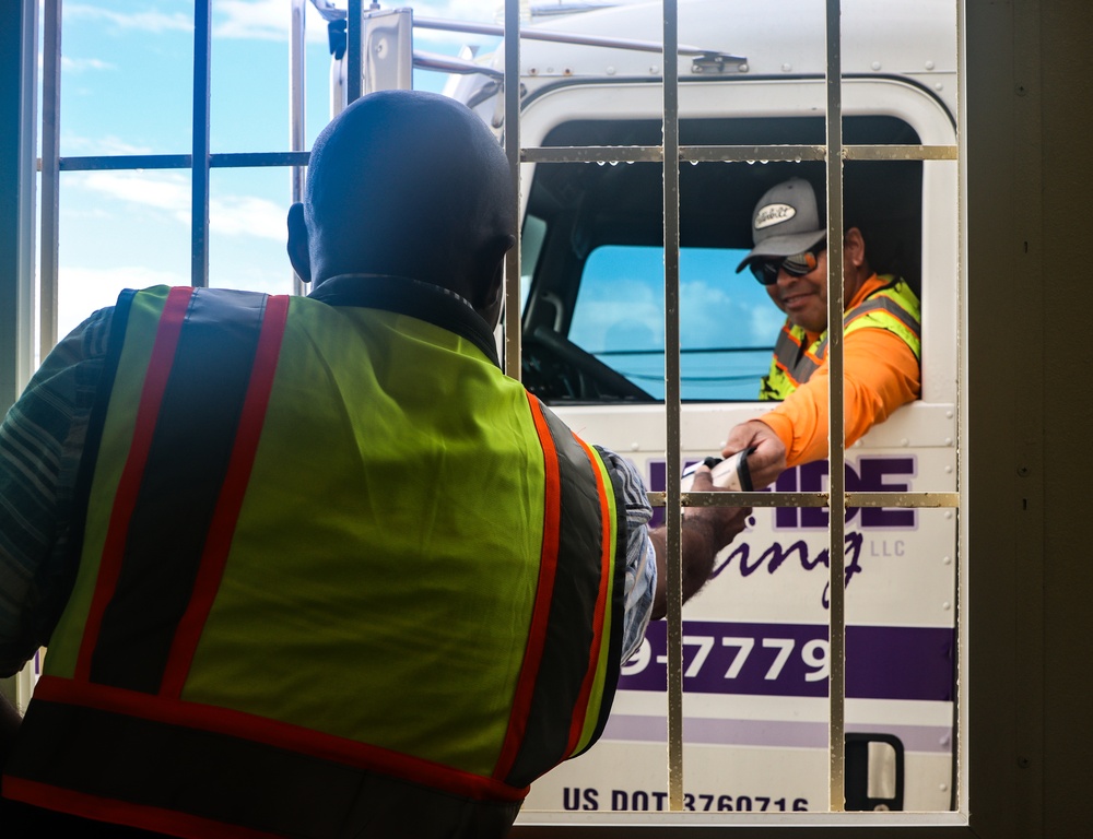 U.S. Army Corps of Engineers contractor verifies truck driver’s credentials as part of the residential debris removal weigh in process