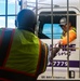 U.S. Army Corps of Engineers contractor verifies truck driver’s credentials as part of the residential debris removal weigh in process