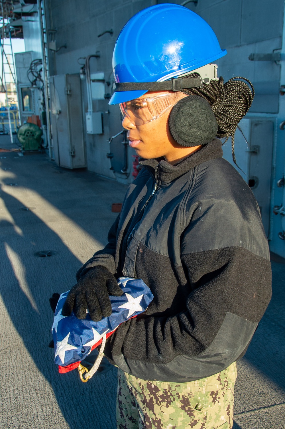 USS Ronald Reagan (CVN 76) Sailors conduct morning colors