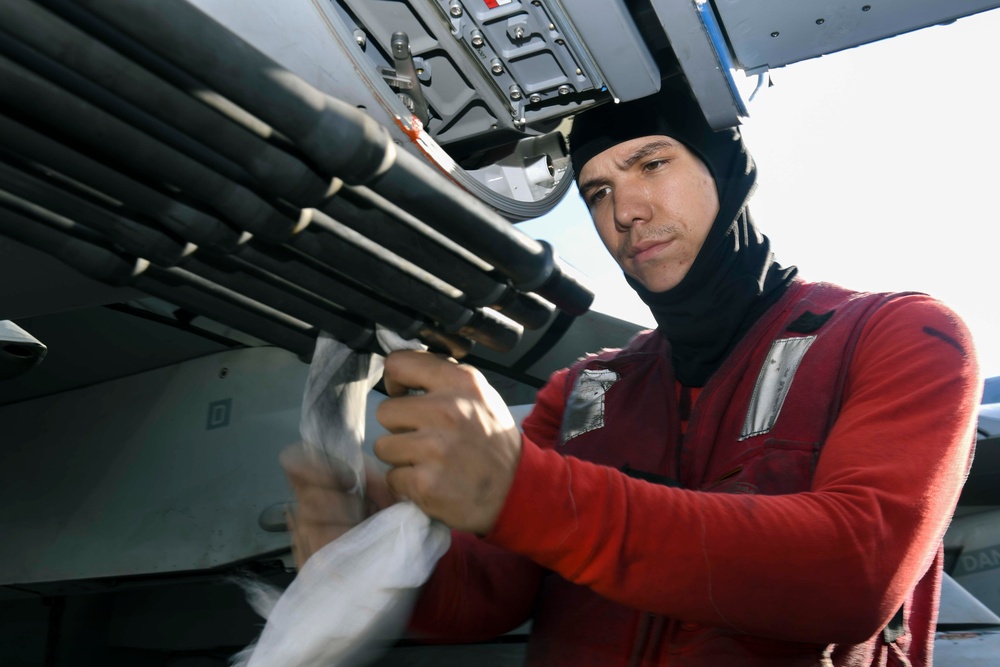 Aviation Ordnanceman Cleans F/A-18E Super Hornet 20mm Gun Aboard USS Carl Vinson (CVN 70)