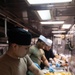 USS Bataan Sailors Cook in Galley