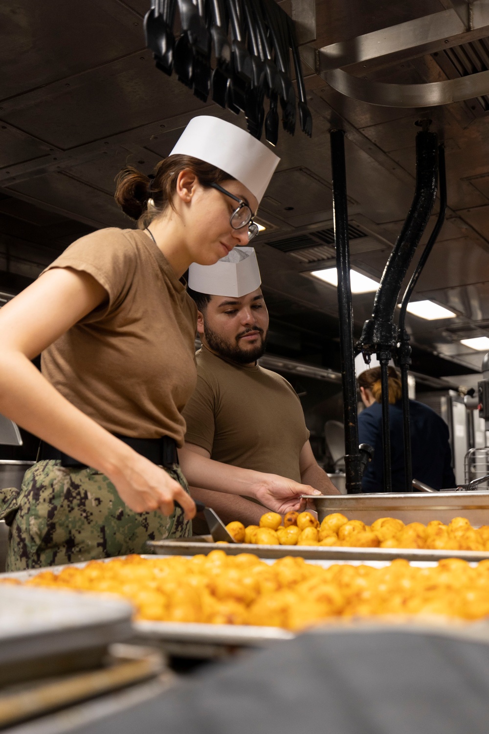 USS Bataan Sailors Cook in Galley