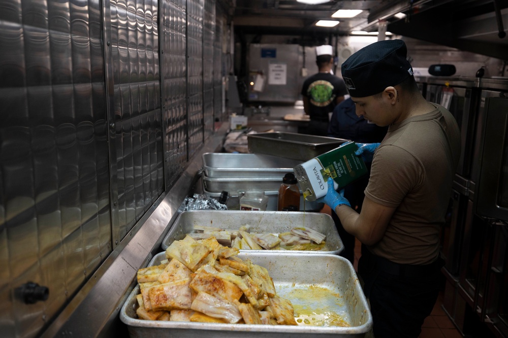 USS Bataan Sailors Cook in Galley