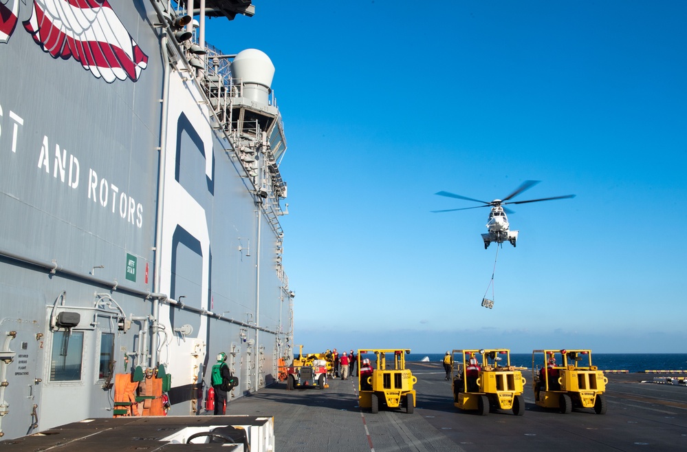 USS America Conducts a Vertical Replenishment Operation with USNS Charles Drew (T-AKE-10)