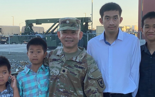 Lt. Col. Hun with his children during promotion ceremony.