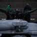 Sailors perform maintenance on MH-60S Seahawk