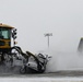 Snowplows clear the flight line at MAFB