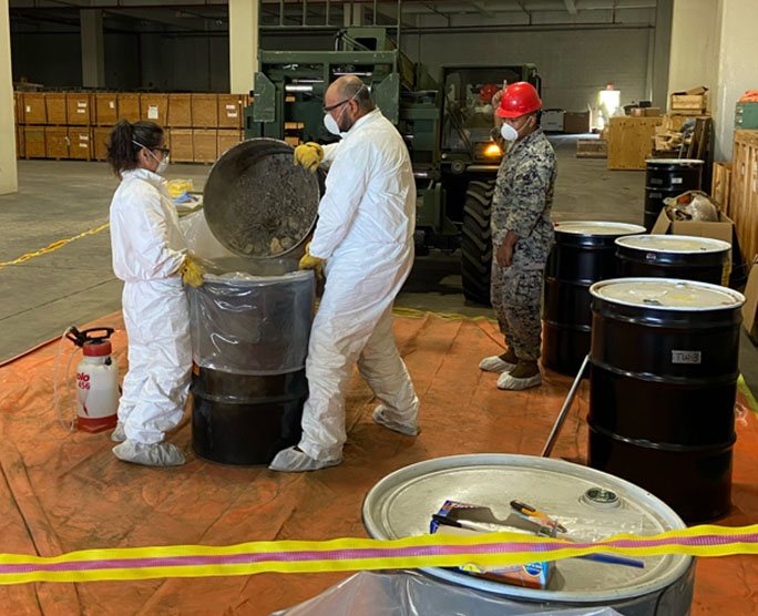 JMC rep oversees packaging of contaminated soil in Japan
