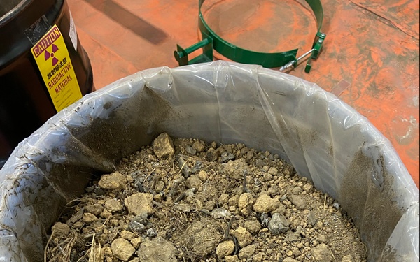 JMC rep oversees packaging of contaminated soil in Japan