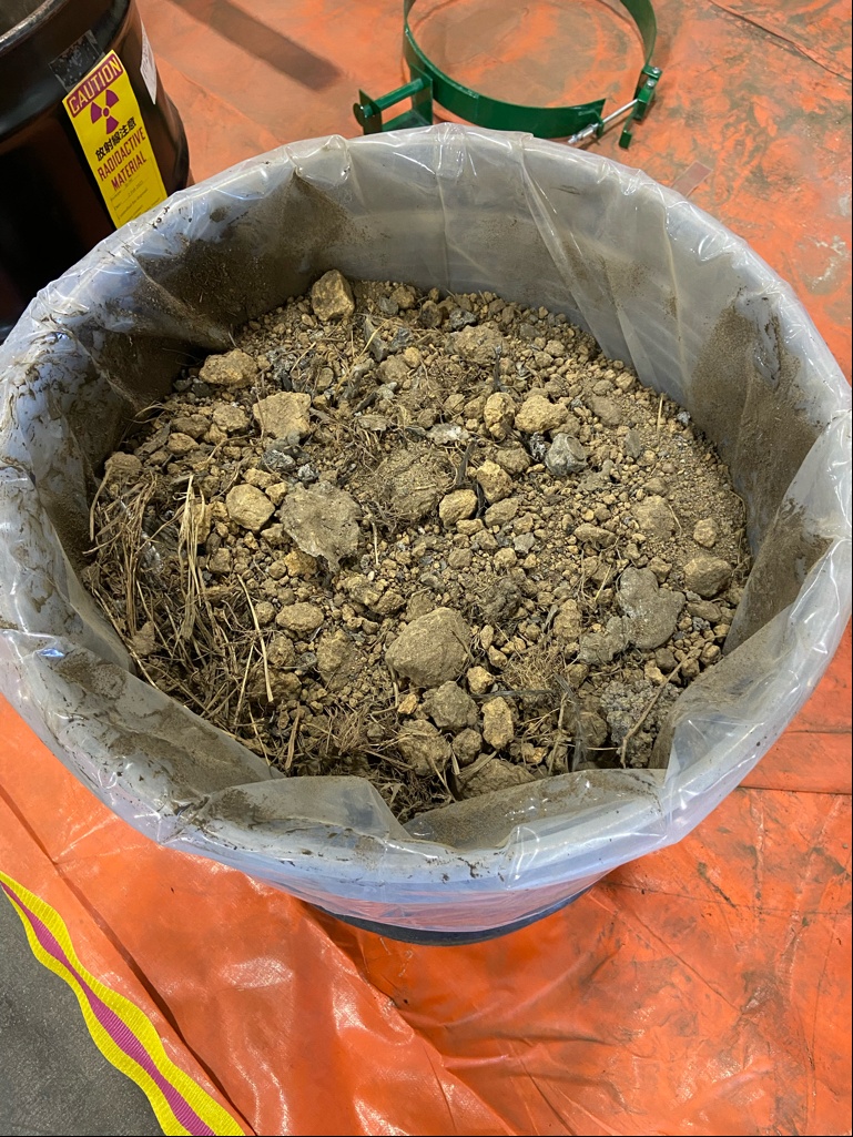 JMC rep oversees packaging of contaminated soil in Japan