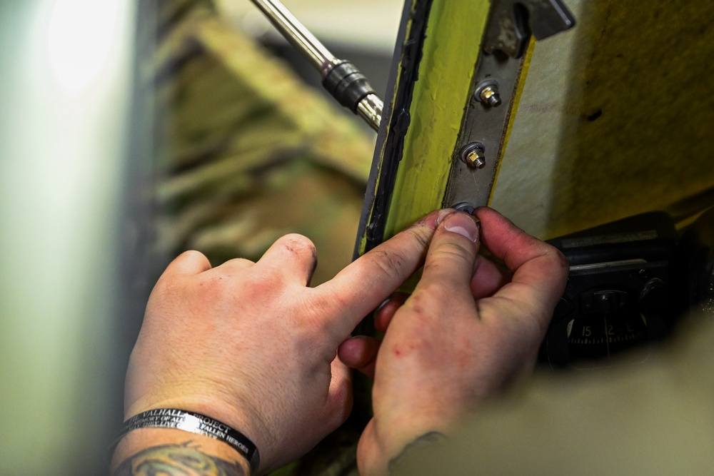 Maintainers replace aircraft window