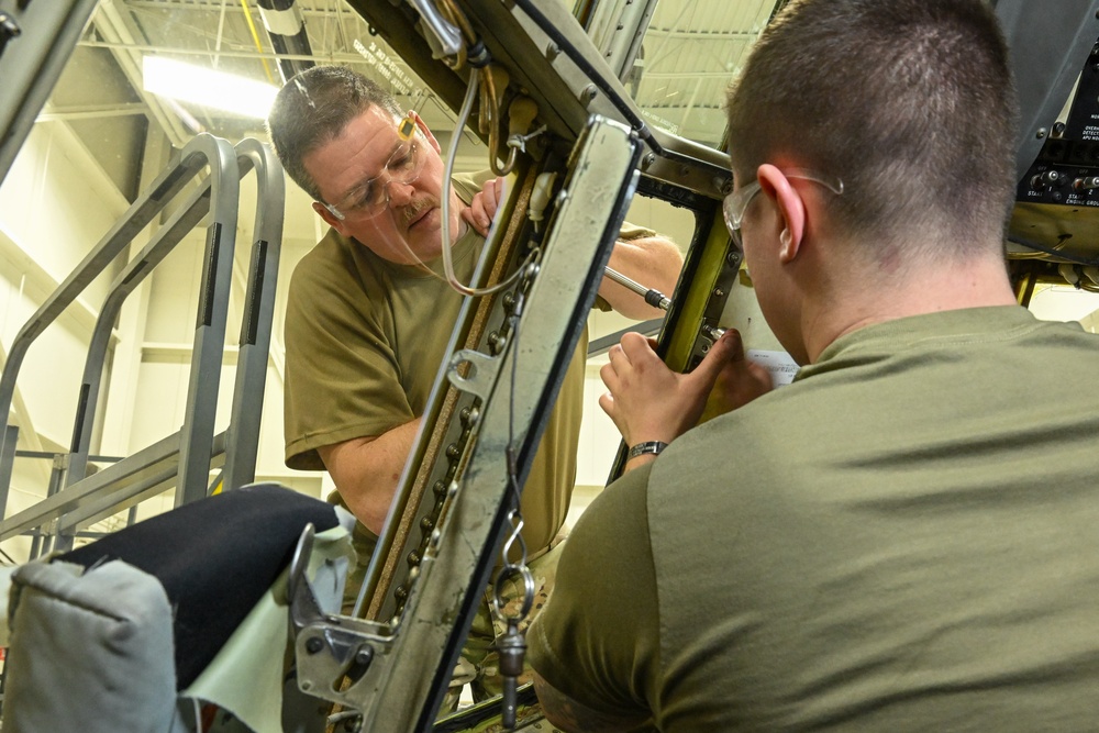 Maintainers replace aircraft window