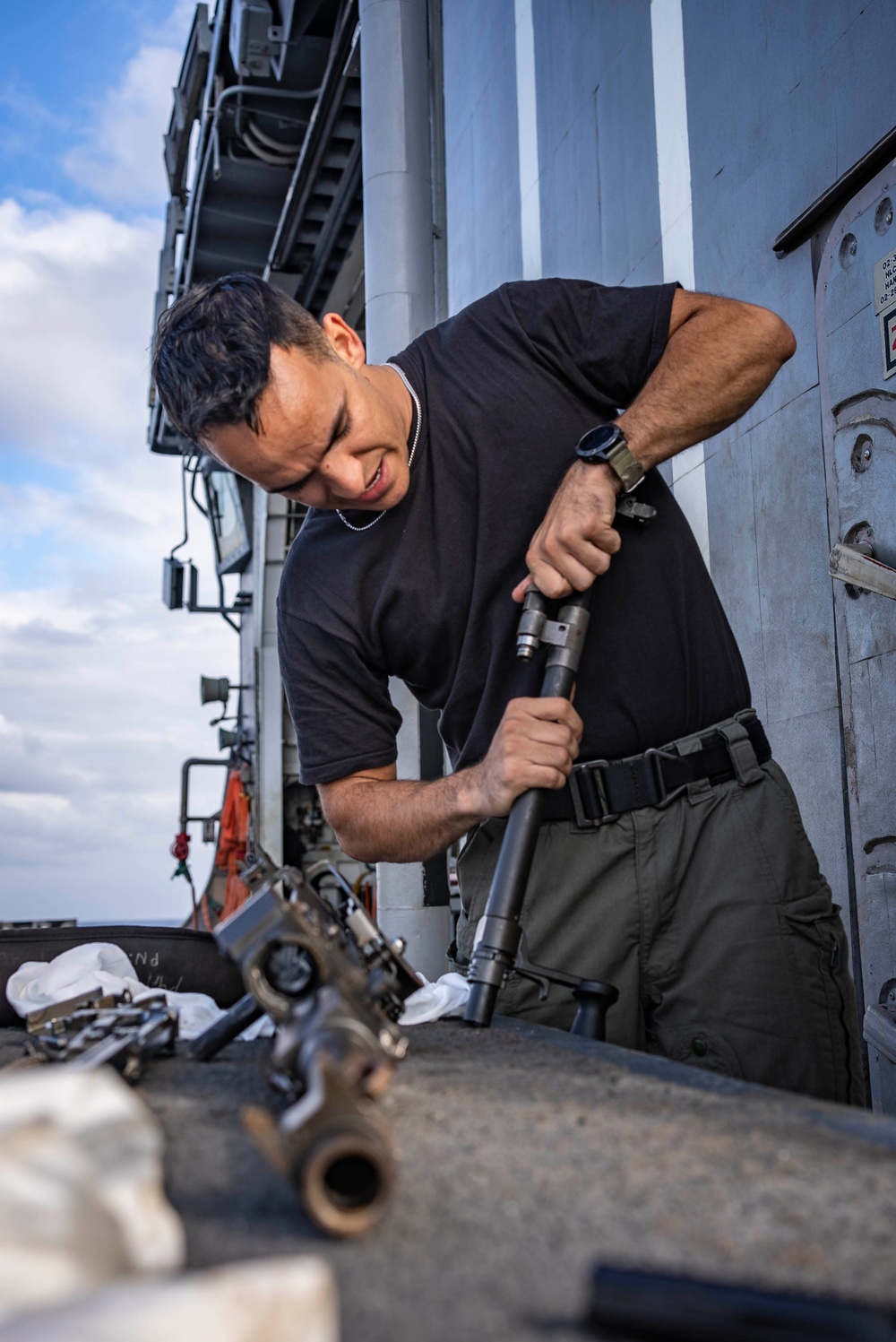 HSM 78 Sailors Conduct Maintenance on an M240 Machine Gun