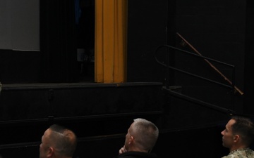 Rear Adm. Stu C. Satterwhite, Commander, MyNavy Career Center (MNCC), speaks with command leadership in Dealey Center Theatre during a scheduled visit to SUBASE, Jan. 24, 2023.