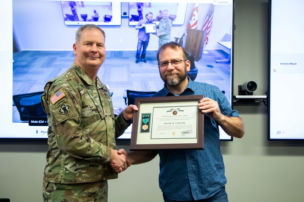 Frank Veraldi receives the Civilian Service Commendation Medal during farewell ceremony