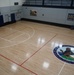 Newly refinished basketball gym floor at Huntington Hall Naval Berthing Facility